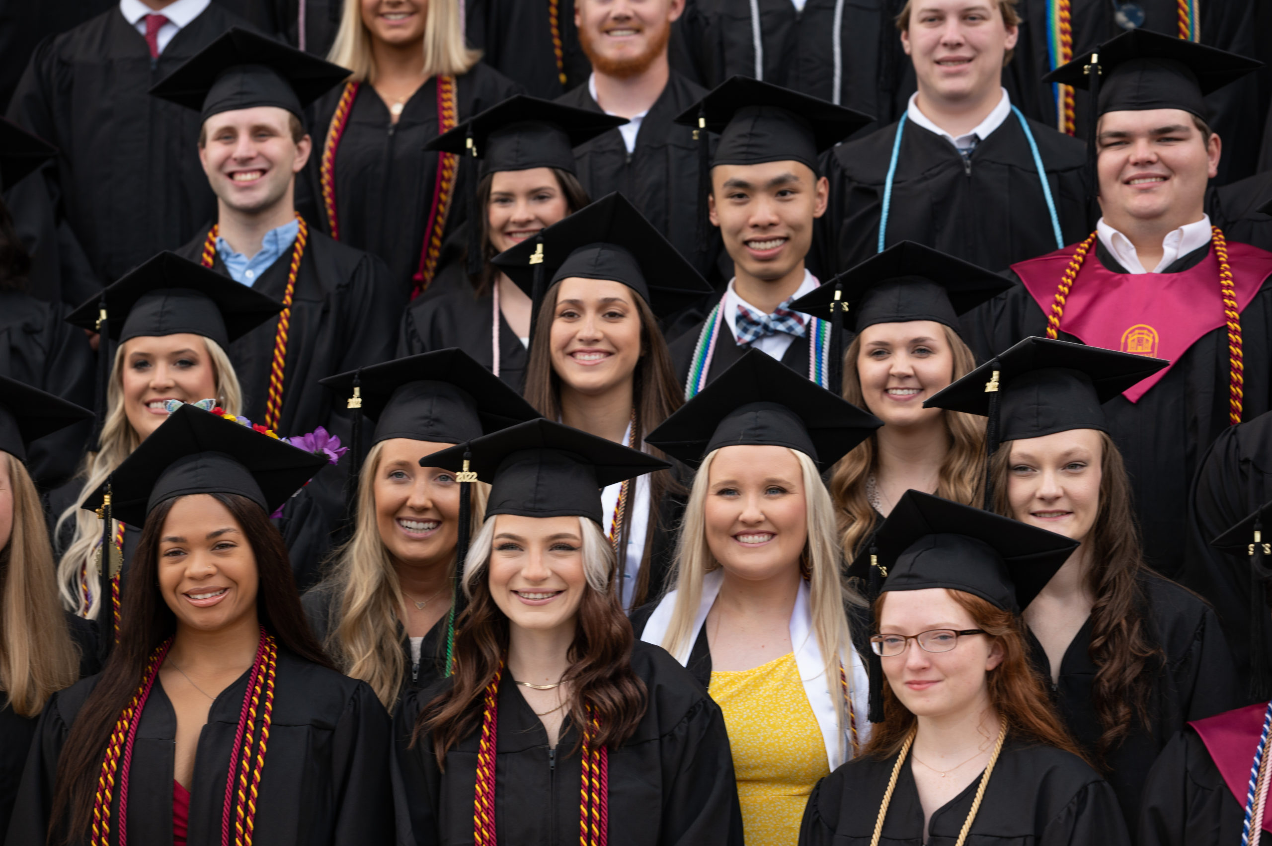 Students pose for a commencement photo.