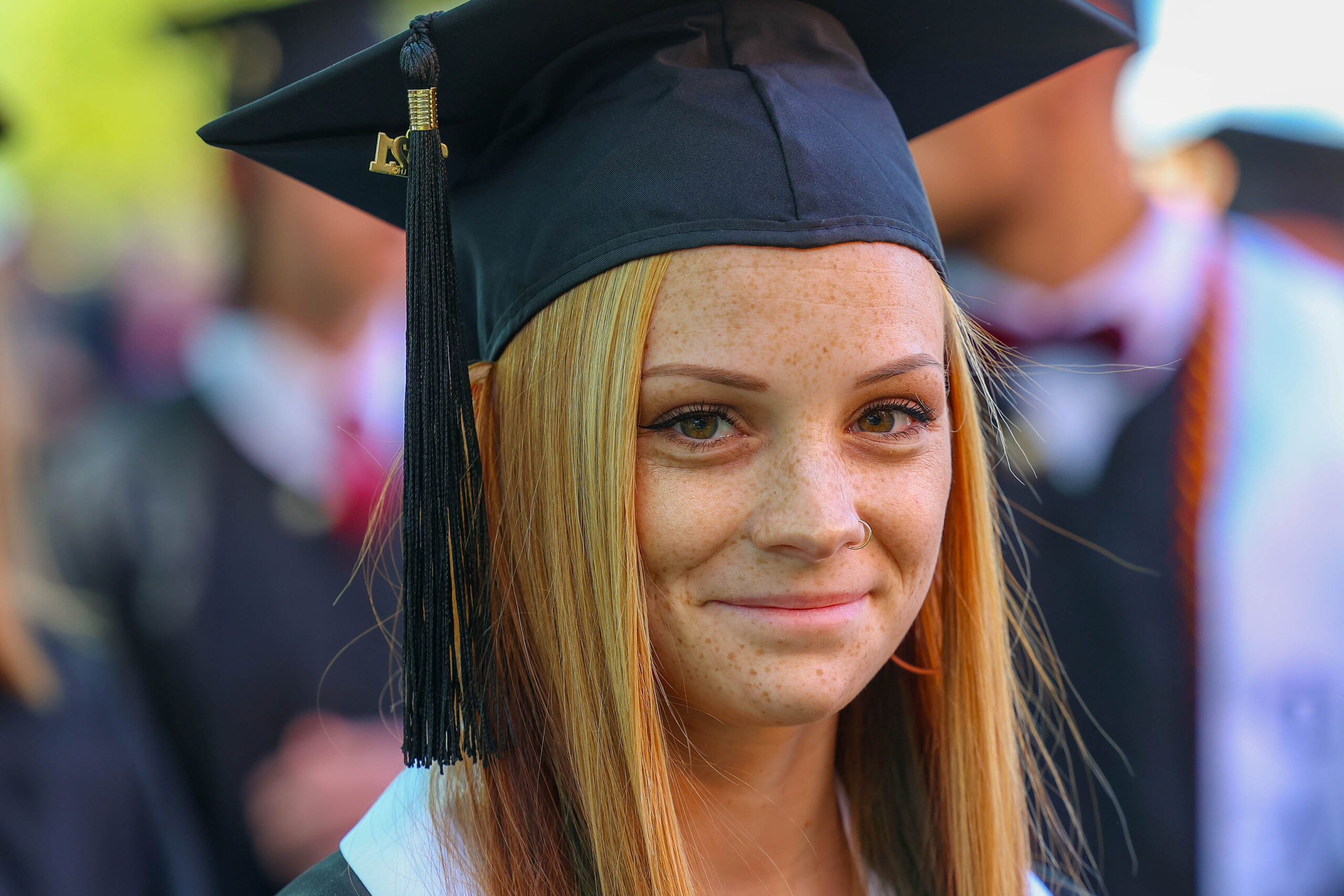 Student poses at Erskine's commencement. Graduate with a degree in Accounting!