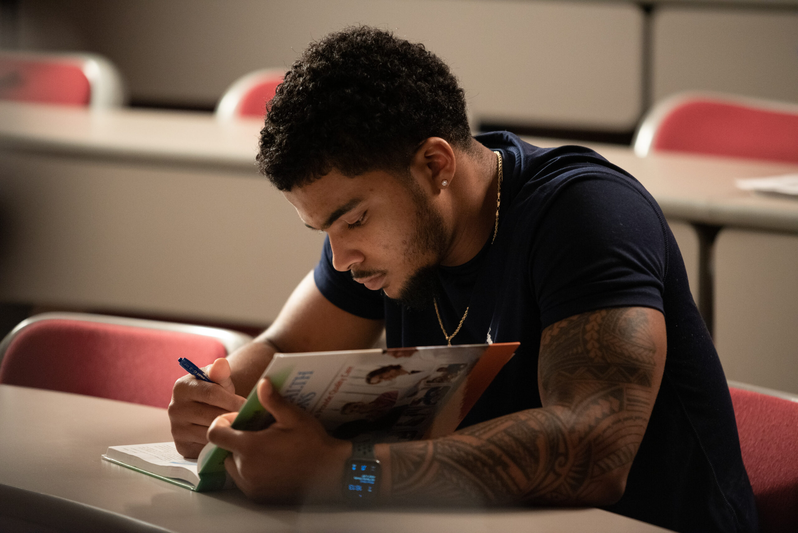 Student studies his textbook.