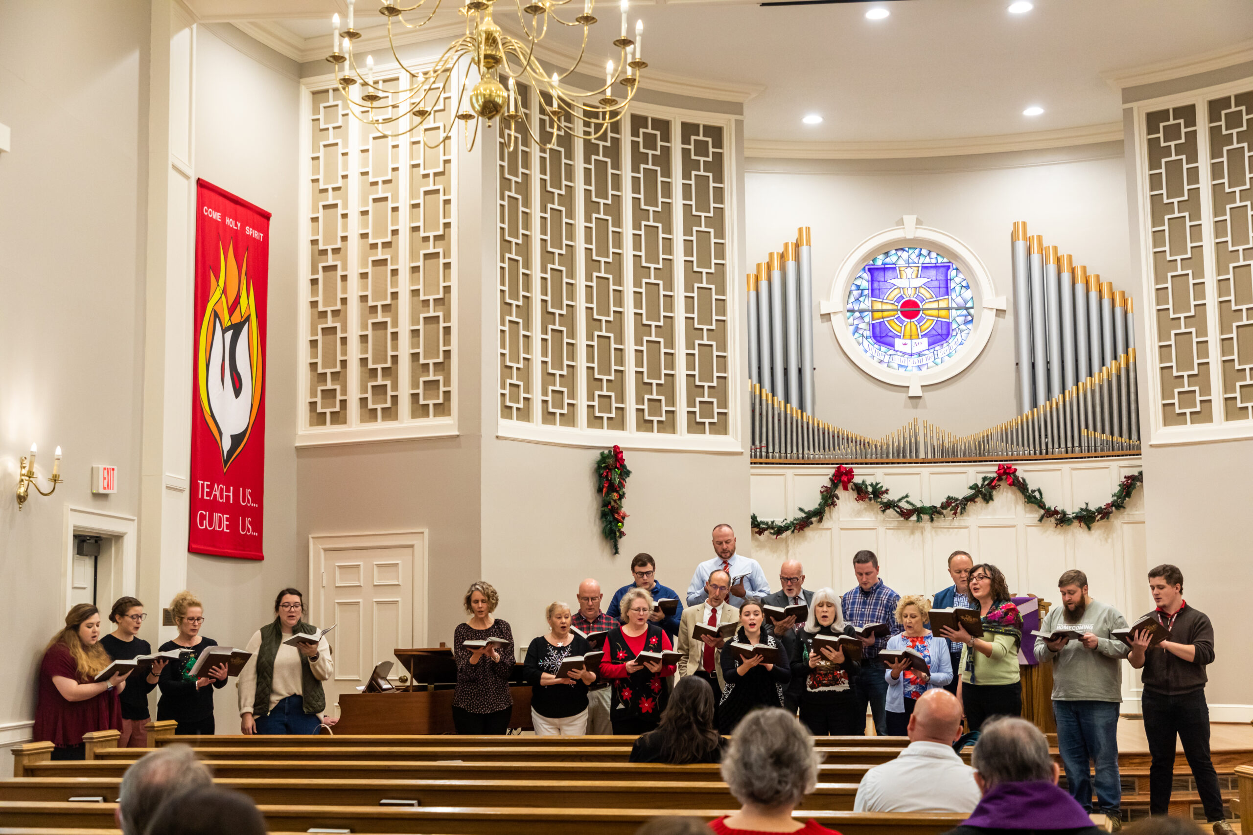 Faculty and staff sing at Lessons & Carols