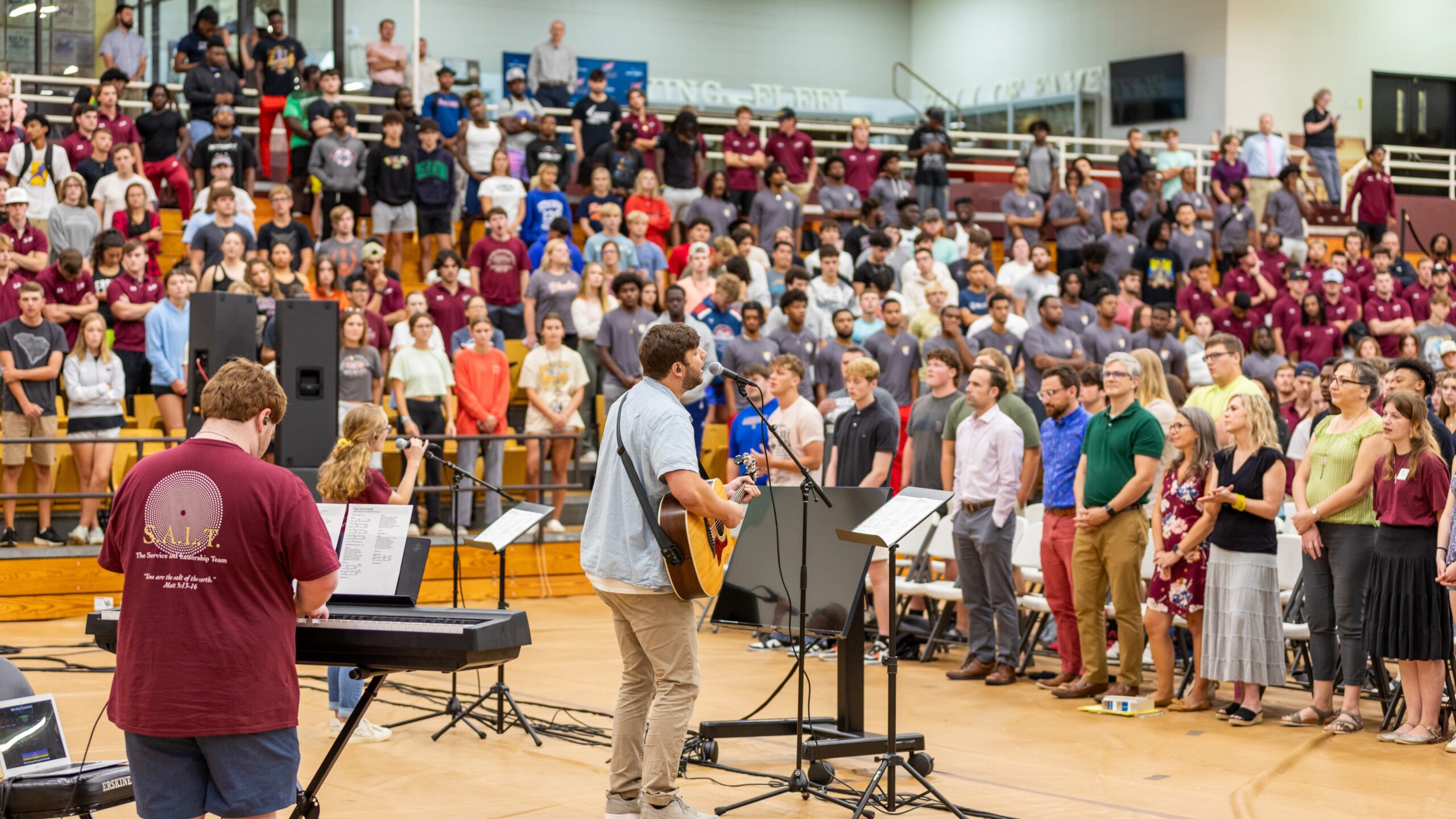 Students and staff join in worship at Fleet Fellowship