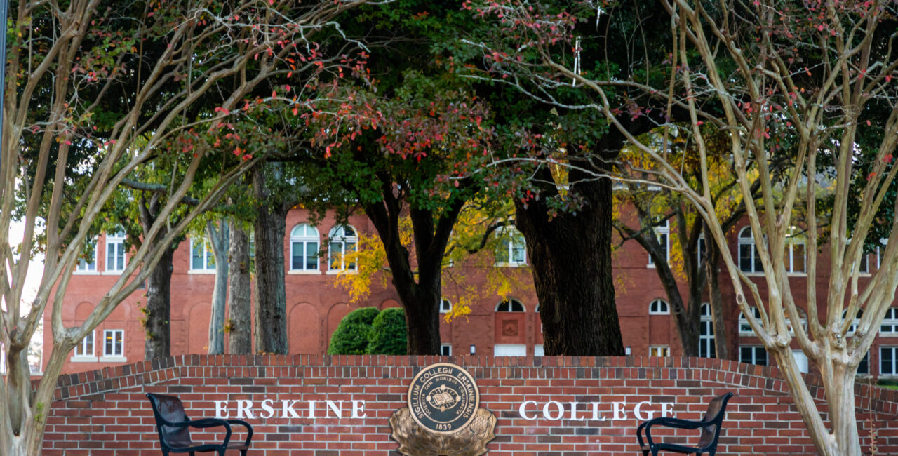 Low Brick Wall On Main Street In Due West, Featuring The College Seal