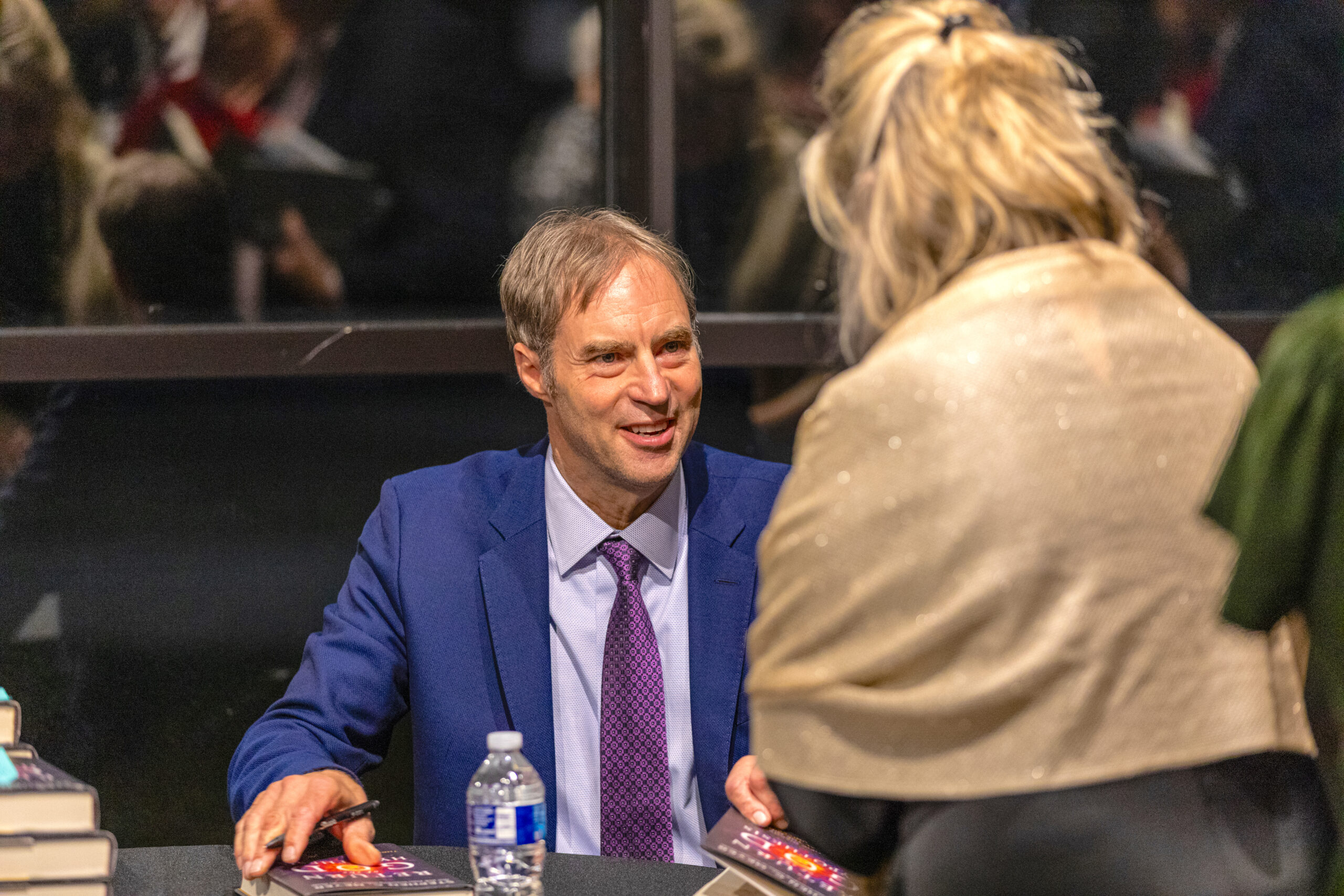 Dr. Stephen Meyer signs copies of his books