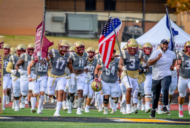 The Erskine College Football team storming the field on game day