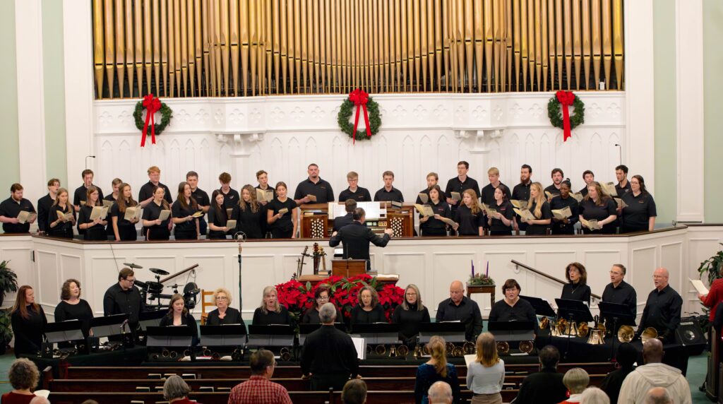 The Choraleers sing at Lessons & Carols, accompanied by Honea Path Baptist Church handbell choir