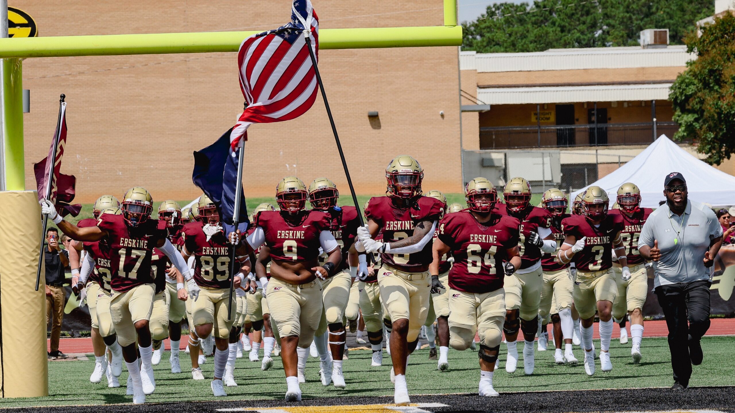Fleet Football runs onto the field