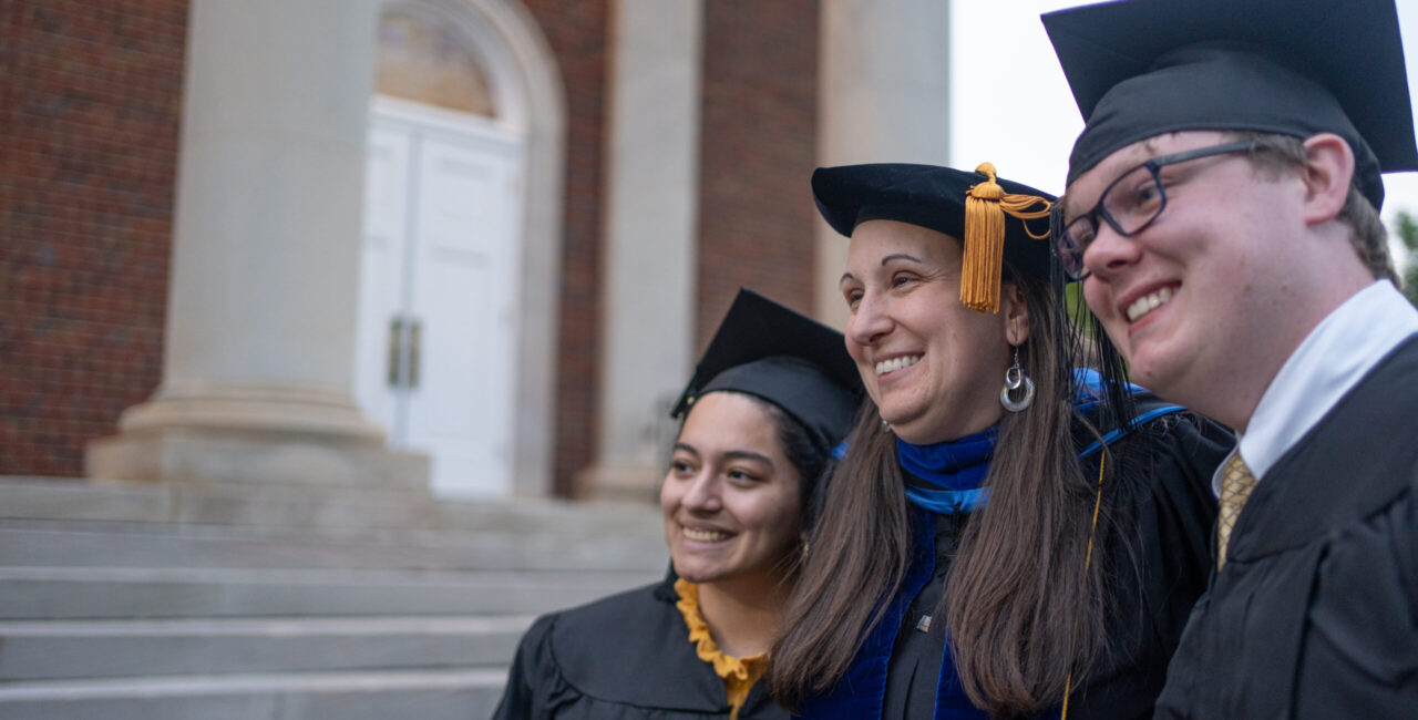 Erskine Professor Briana Van Scoy Poses At Baccalaureate With Two Students