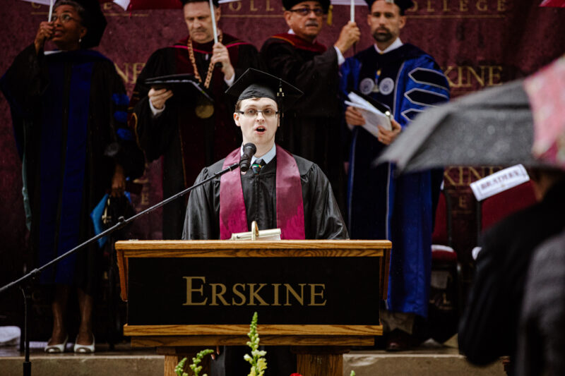 James Alexander Thomas, a member of the Class of 2024, leads the singing of the Alma Mater.