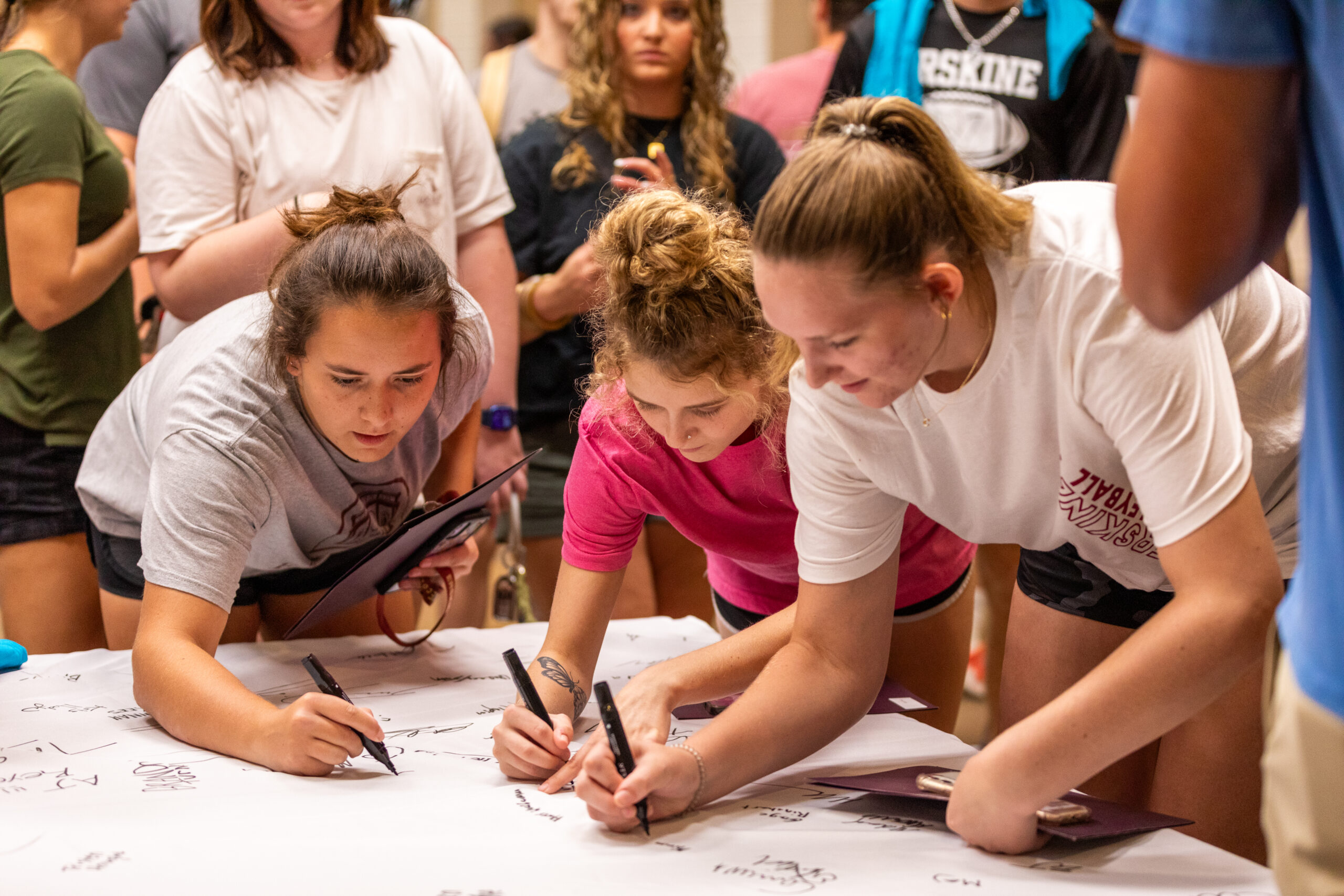 Erskine freshmen sign the table cloth