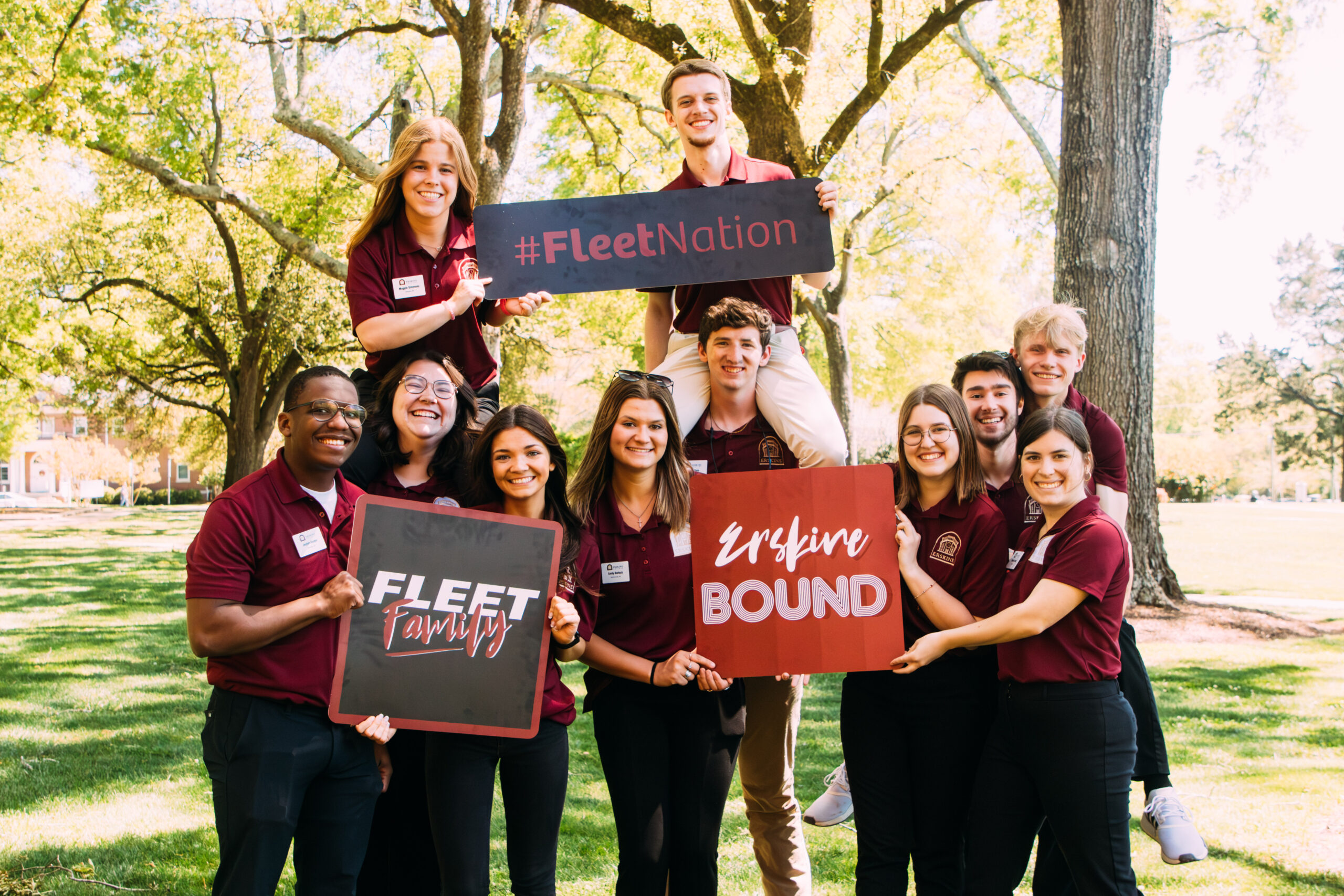 Erskine student ambassadors pose with Erskine Bound signs