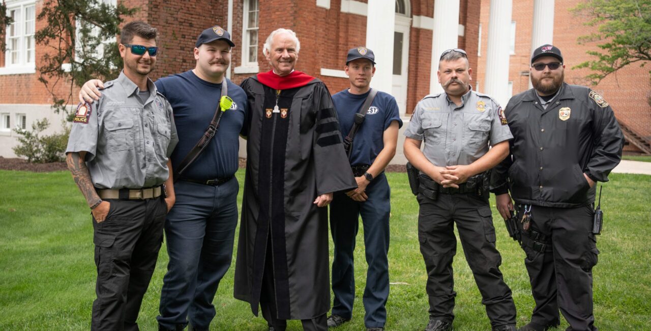 Shown In Photo At Top, Taken At Erskine’s 2023 Commencement, Are, From Left, ECPD Officer Justin Smith, Who Also Serves In Fire And Safety And As An EMT; Reles Littleton ’24, Then A Campus Patrol Team Volunteer, Who Assisted With Event Security, Served As A Firefighter And EMT For Due West Fire & Rescue, And Now Serves As A Firefighter And EMT In Clinton; South Carolina Governor Henry McMaster, Commencement Speaker And Honorary Degree Recipient; Alex Hesslegrave ’24, Then A Campus Patrol Team Volunteer, Who Assisted With Event Security And Serves As A Firefighter And EMR For Due West Fire & Rescue; ECPD Chief Matthew Busby; And ECPD Sergeant Daniel Woodson.