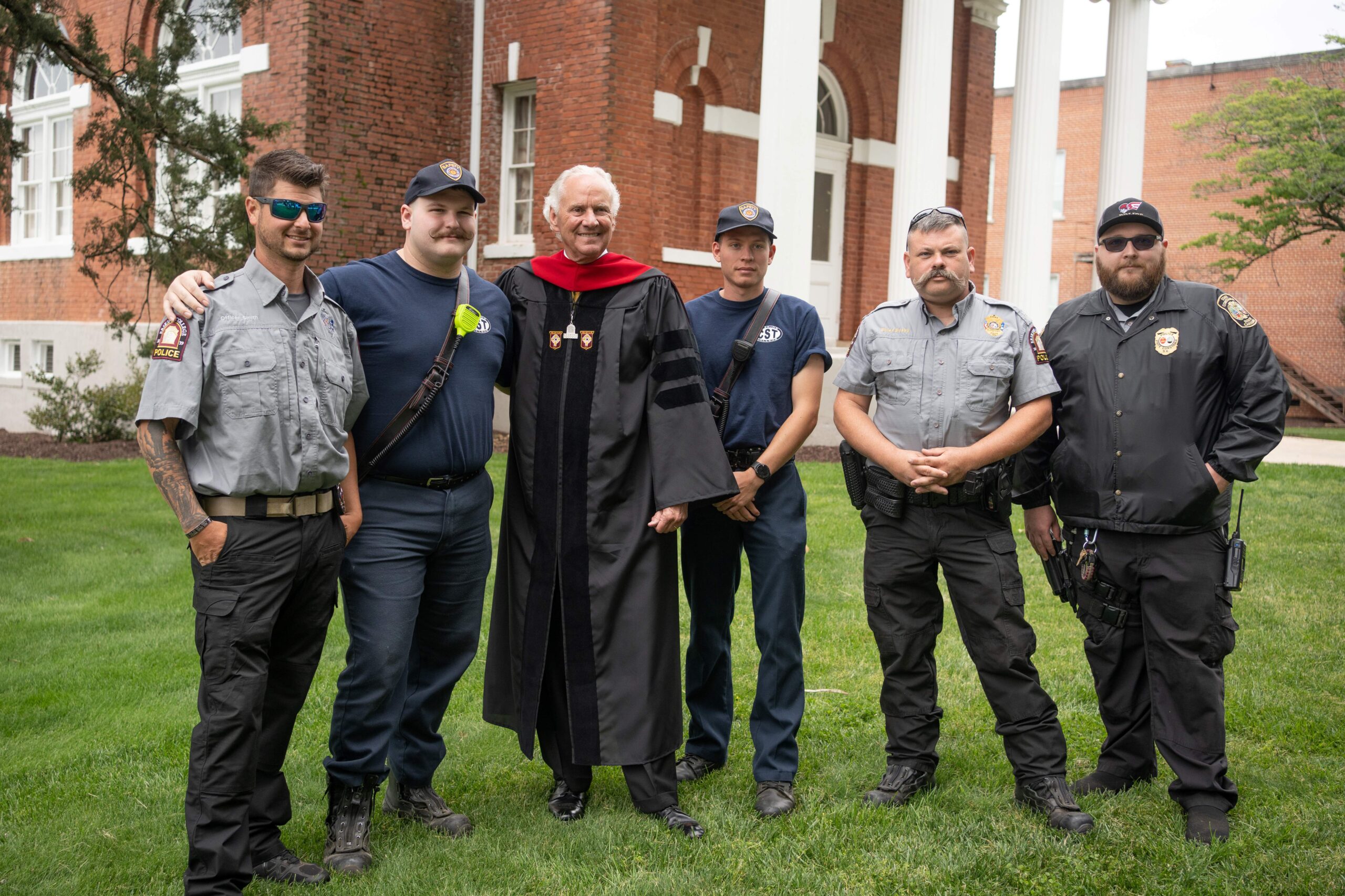 Shown in photo at top, taken at Erskine’s 2023 commencement, are, from left, ECPD Officer Justin Smith, who also serves in fire and safety and as an EMT; Reles Littleton ’24, then a Campus Patrol Team volunteer, who assisted with event security, served as a firefighter and EMT for Due West Fire & Rescue, and now serves as a firefighter and EMT in Clinton; South Carolina Governor Henry McMaster, commencement speaker and honorary degree recipient; Alex Hesslegrave ’24, then a Campus Patrol Team volunteer, who assisted with event security and serves as a firefighter and EMR for Due West Fire & Rescue; ECPD Chief Matthew Busby; and ECPD Sergeant Daniel Woodson.
