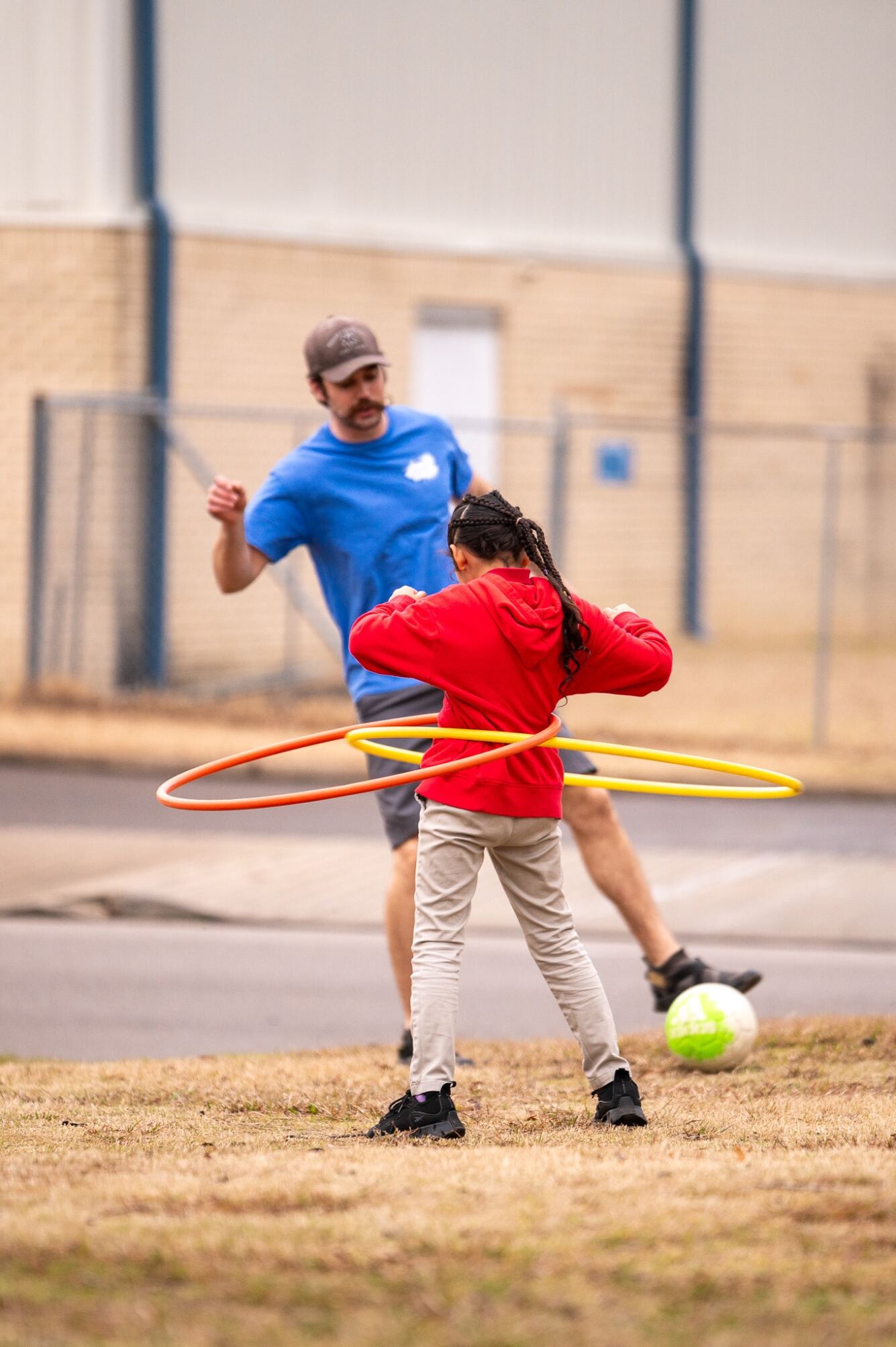 An Erskine student plays with a child on a spring break mission trip