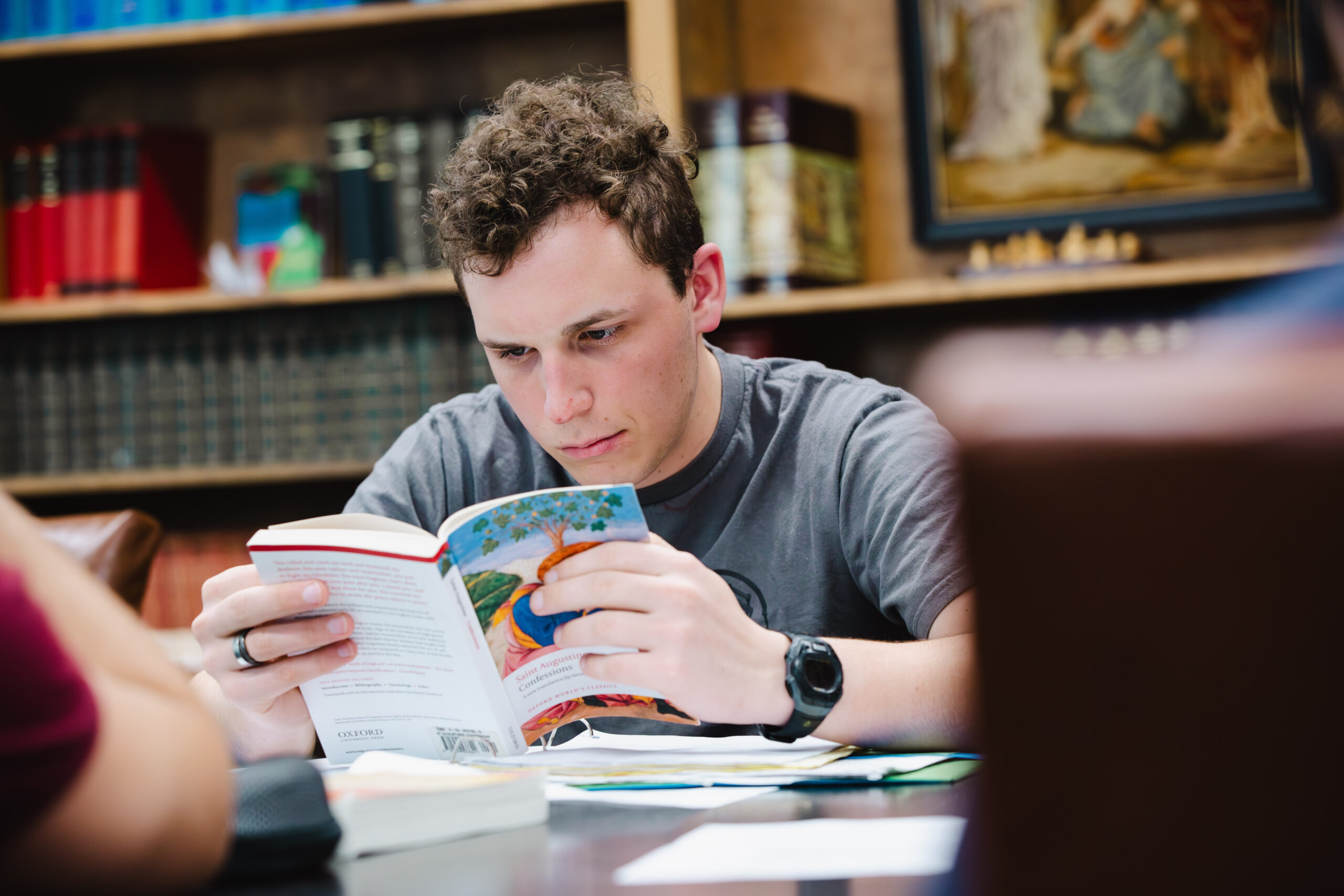 Honors student reading a book