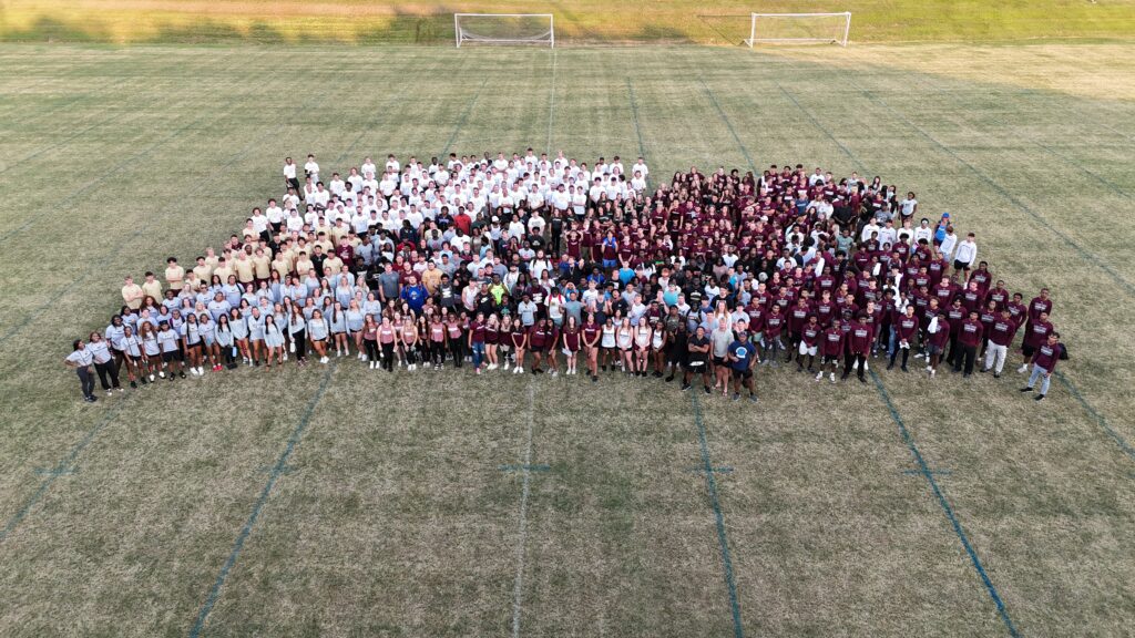 Erskine athletes pose together on a field