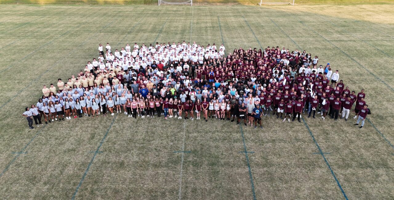 Erskine athletes pose together on a field