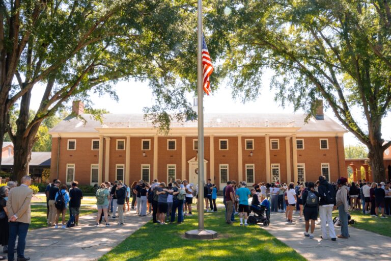 Erskine faculty, staff, and students gather for prayer at the flagpole