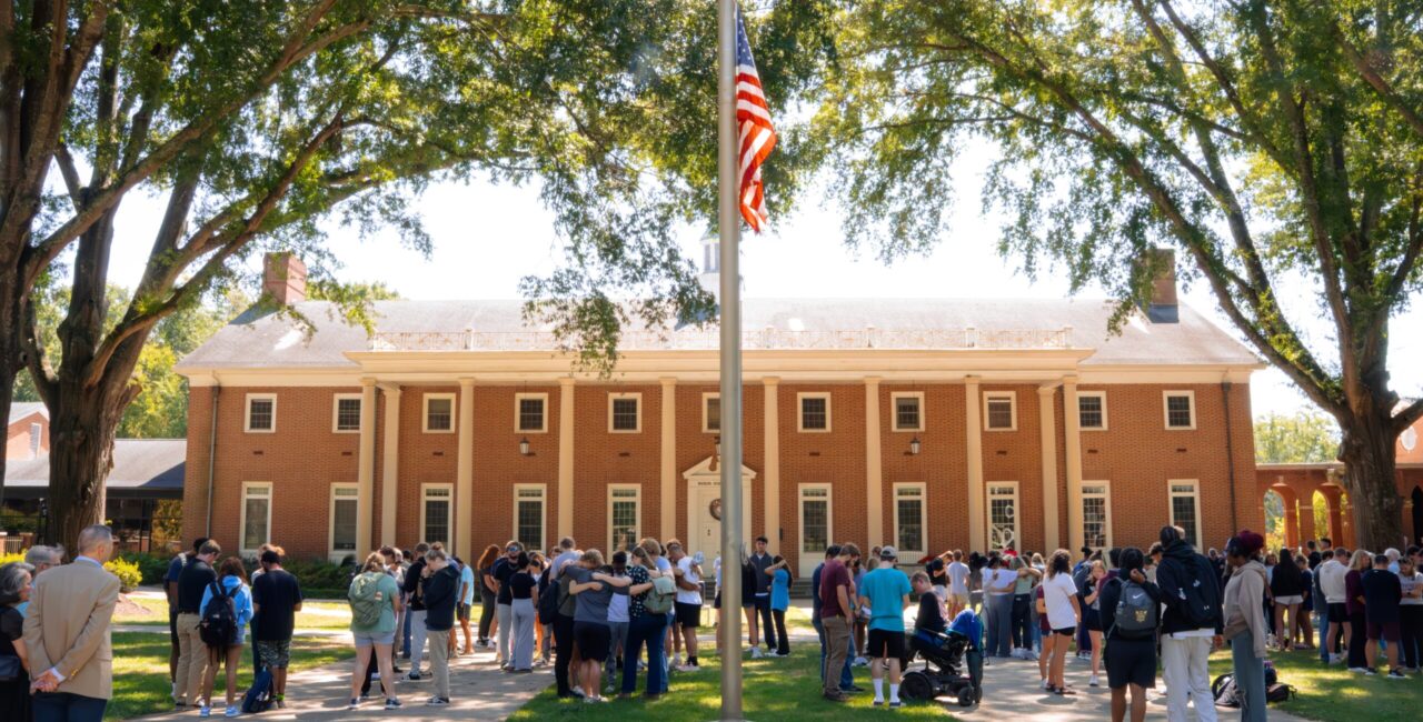 Erskine faculty, staff, and students gather for prayer at the flagpole
