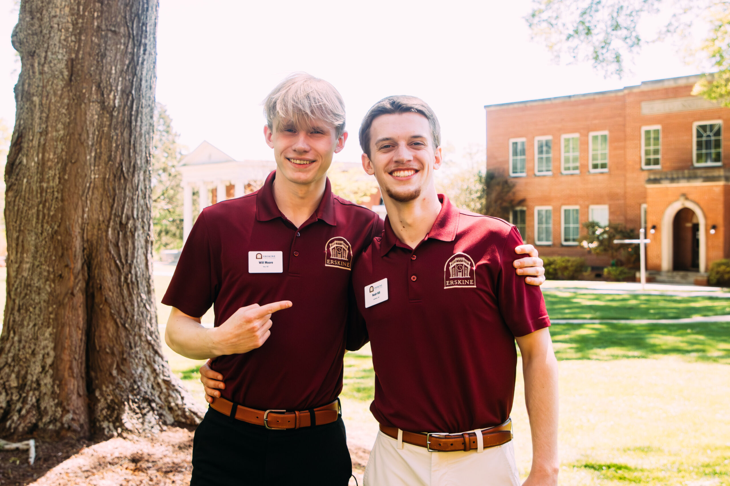 Two Erskine students stand outside near the Reid building