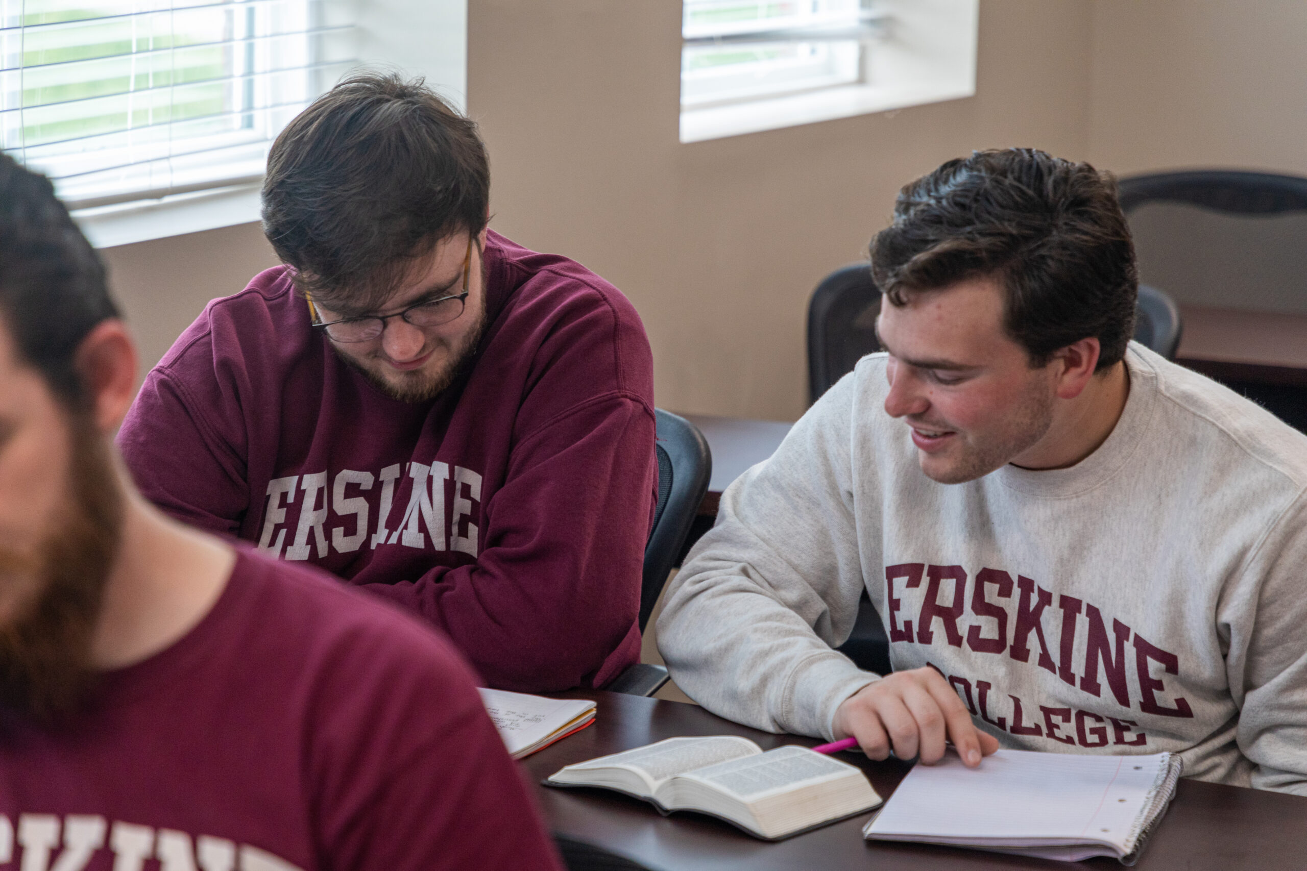 Two students study in class
