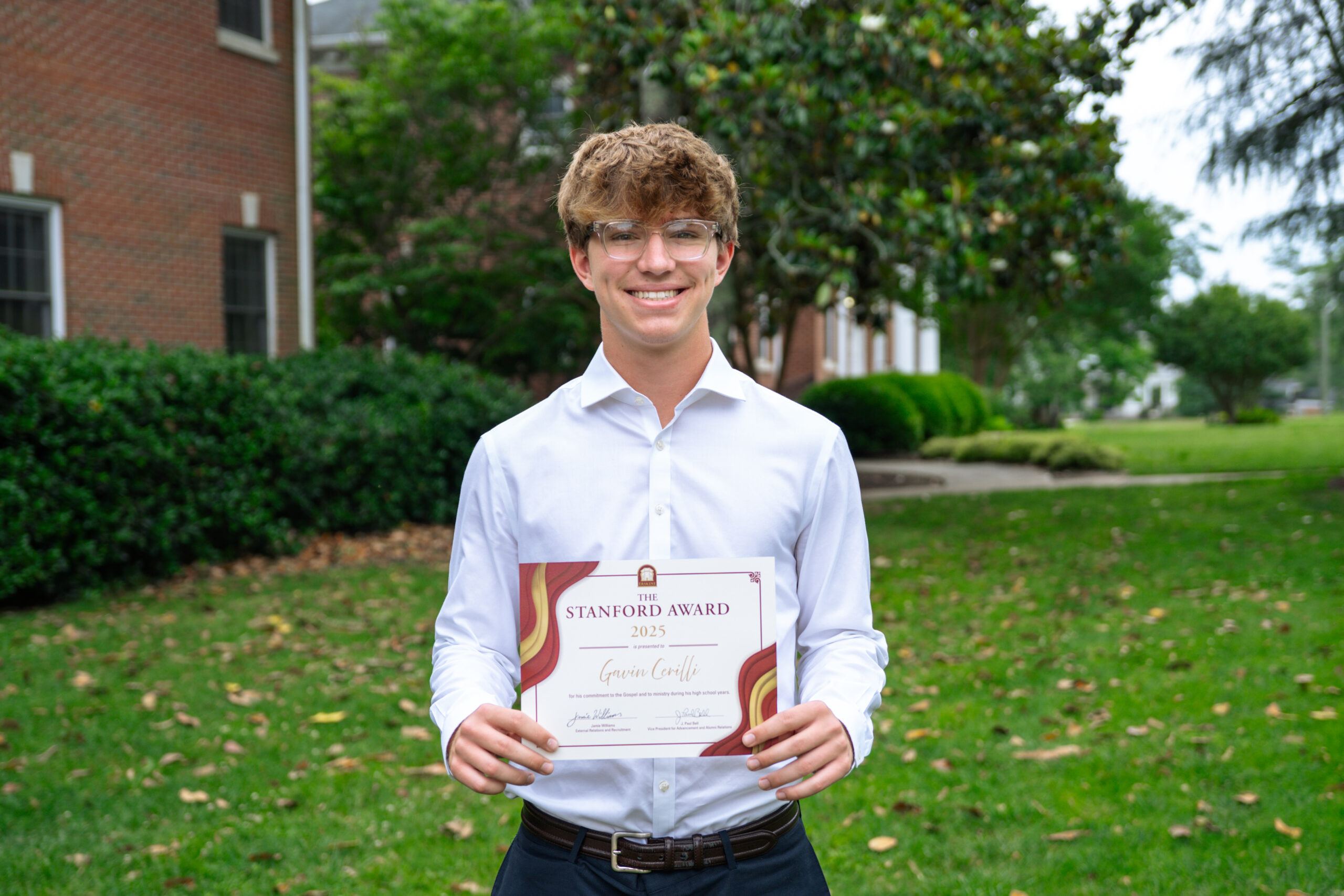 Student Gavin Cerilli, a 2025 Stanford Award winner, holds his certificate