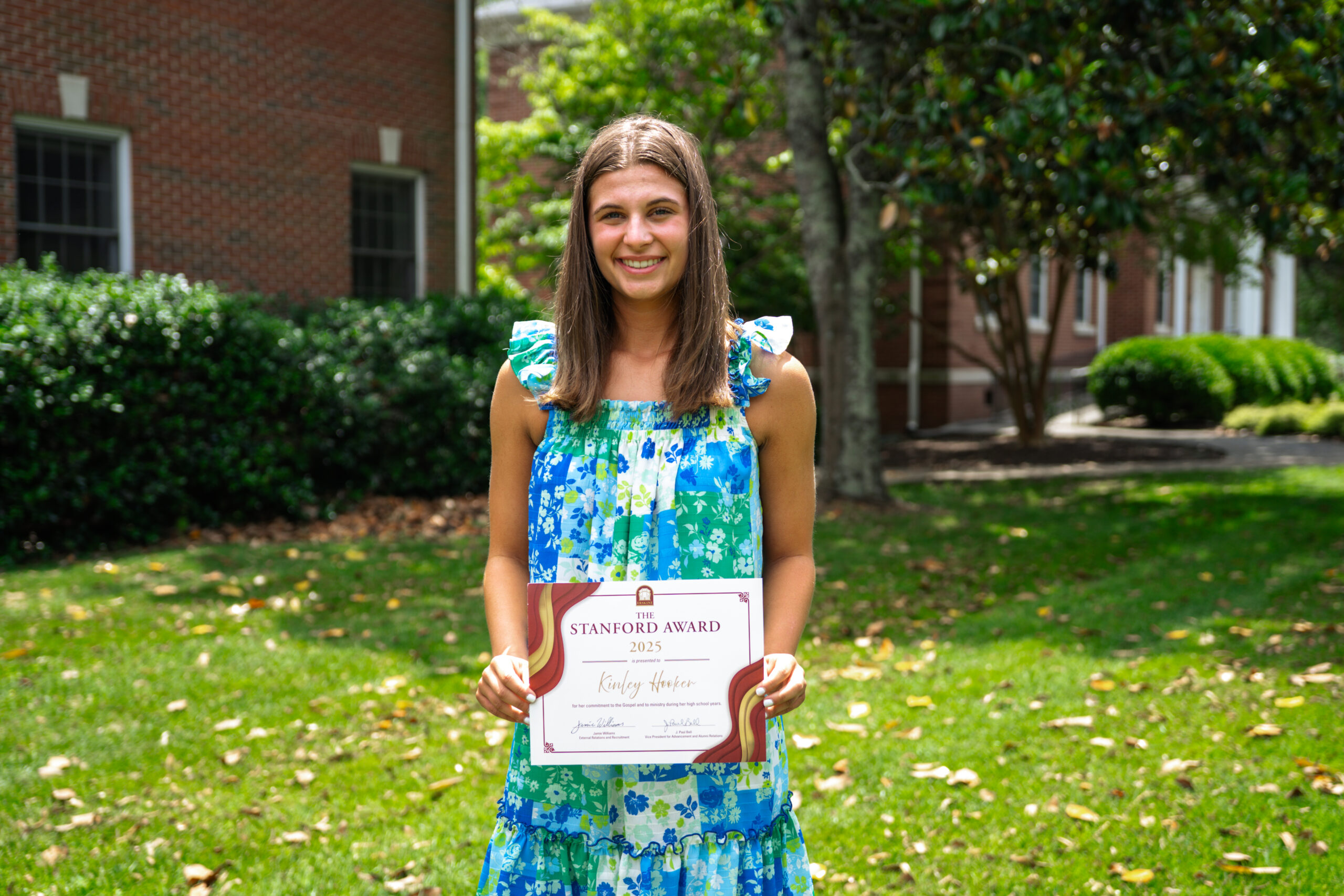 Student Kinley Hooker, a 2025 Stanford Award winner, holds her certificate