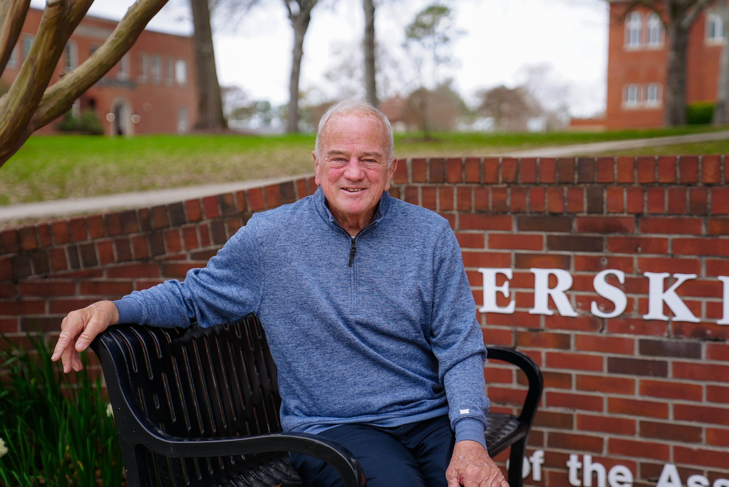 Ralph Lundy sitting on a bench at Erskine