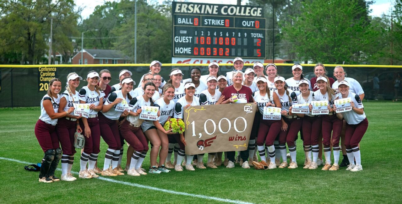 Erskine coach Alleen Hawkins poses with her team after her 1,000 win
