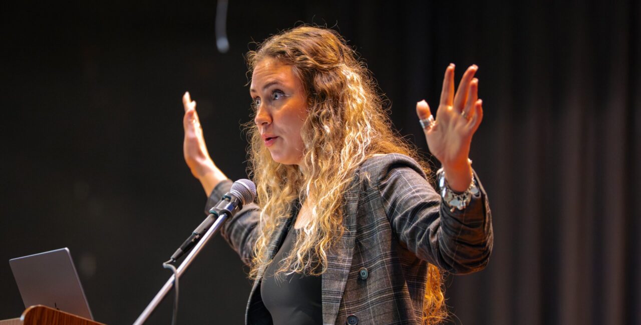 Faith Womack speaks at an evening event in Lesesne Auditorium. 