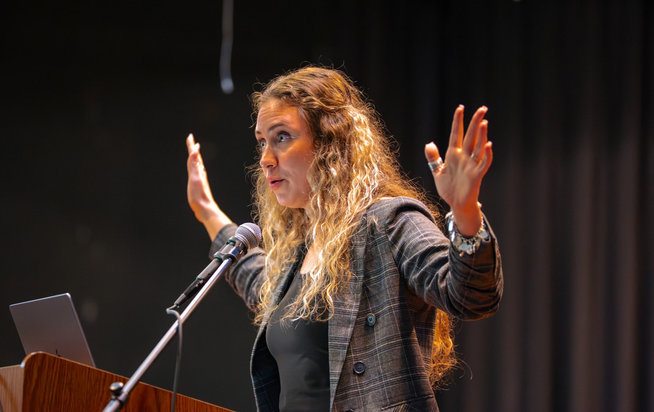 Faith Womack speaks at an evening event in Lesesne Auditorium. 