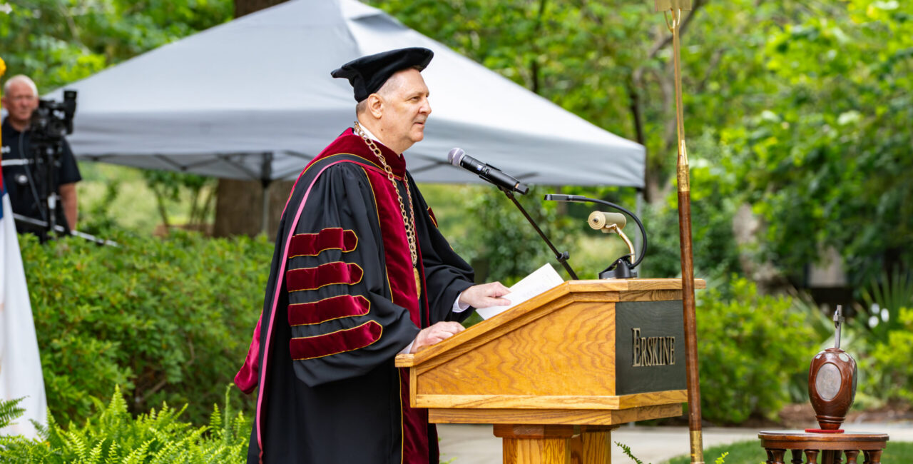 Dr. Adamson of Erskine College addresses the audience at the 2026 commencement.
