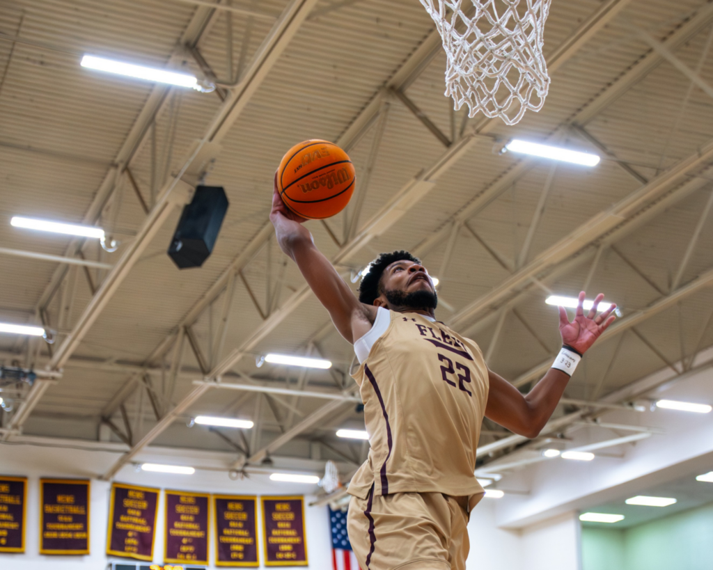 Erskine College's Quintel Johnson dunks during a pregame drill at Red Myers Court