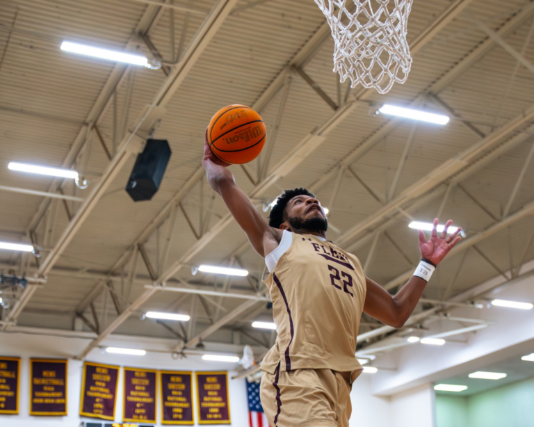 Erskine College's Quintel Johnson dunks during a pregame drill at Red Myers Court