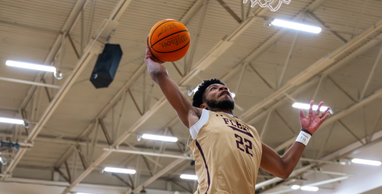Erskine College's Quintel Johnson dunks during a pregame drill at Red Myers Court