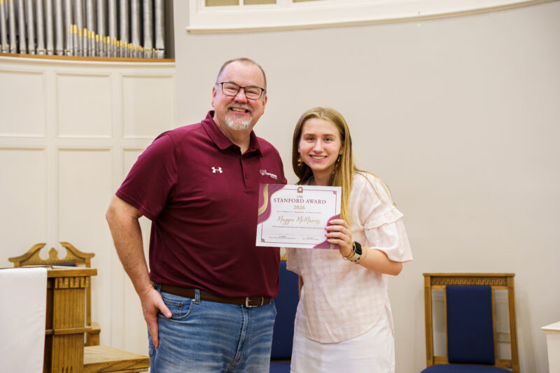 Maggie McManus receives her Stanford award from Jamie Williams.