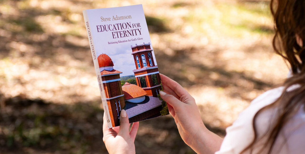 Person looks from left at Dr. Steve Adamson's new book