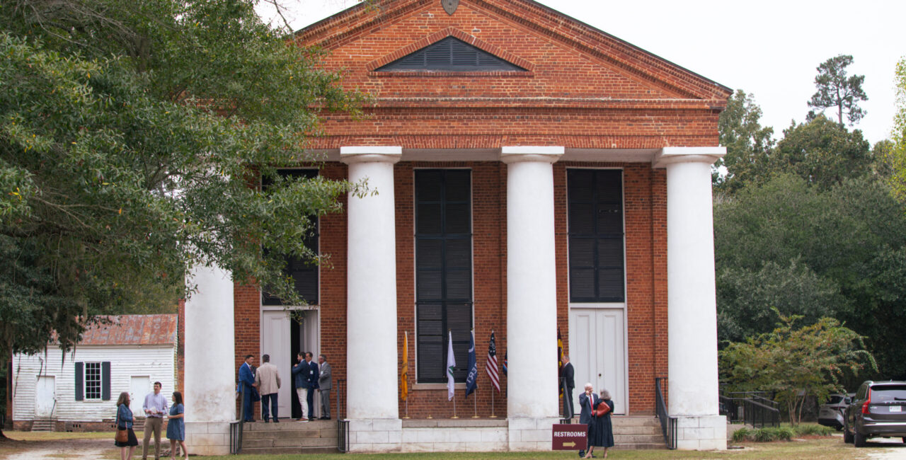 Salem Black River church, pictured with people in front of it.