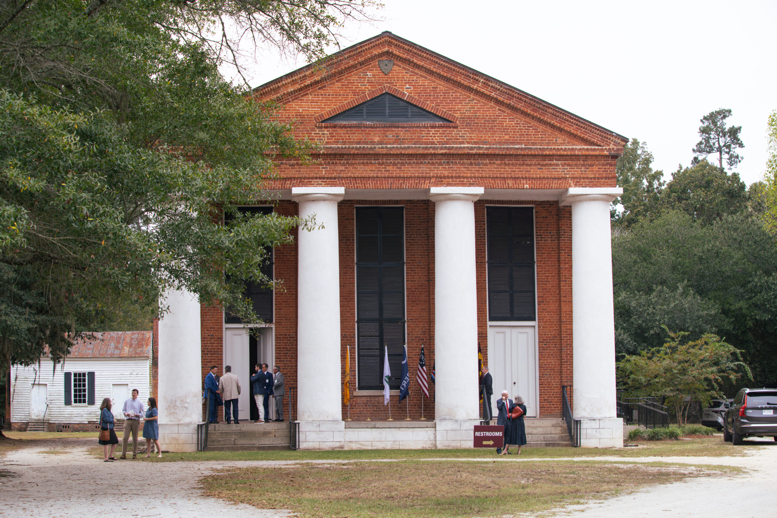 Salem Black River church, pictured with people in front of it.